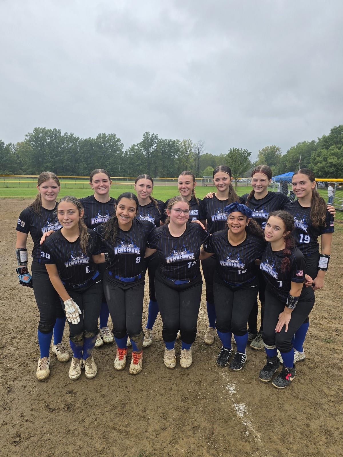 Lake Erie Vengeance players together on the softball field